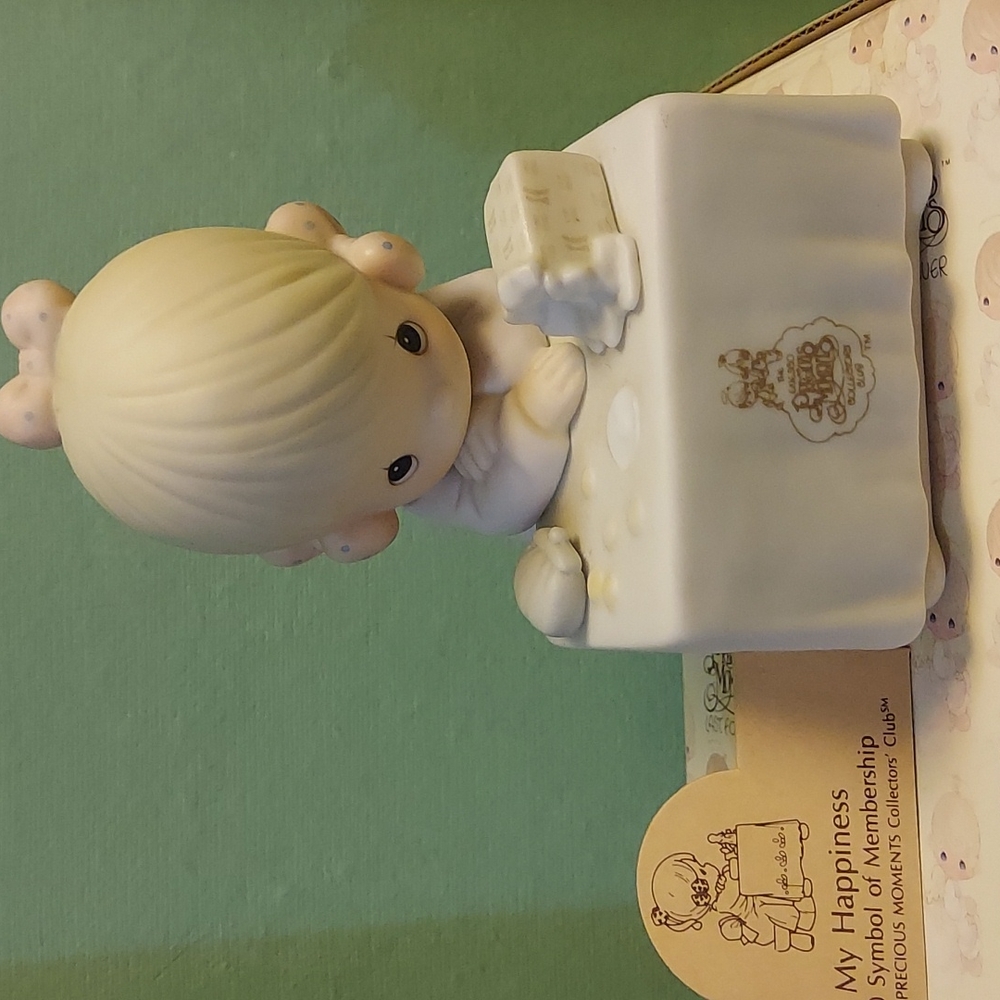 Precious Moments, My Happiness figurine the symbol of membership.